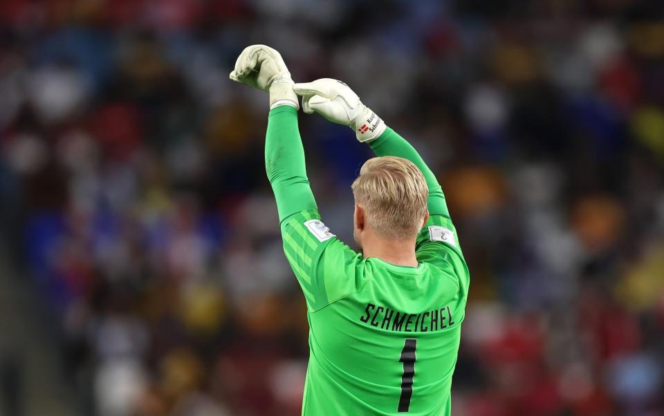 Kasper Schmeichel of Denmark points to his wrist as time ticks away during the FIFA World Cup - Getty Images/Youssef Loulidi