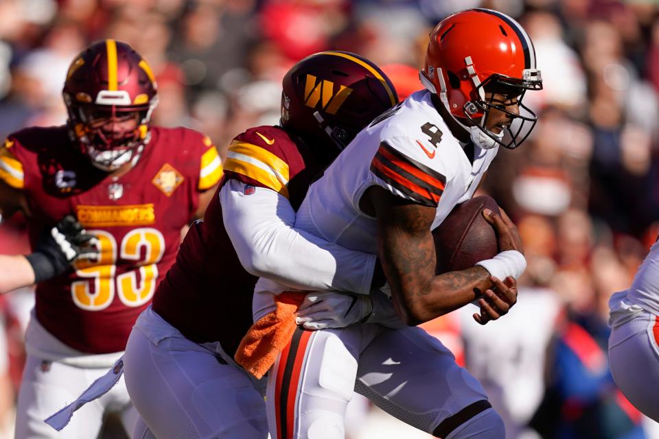 Washington Commanders defensive tackle Daron Payne (94) sacks Cleveland Browns quarterback Deshaun Watson (4) during the first half of an NFL football game, Sunday, Jan. 1, 2023, in Landover, Md. (AP Photo/Patrick Semansky)