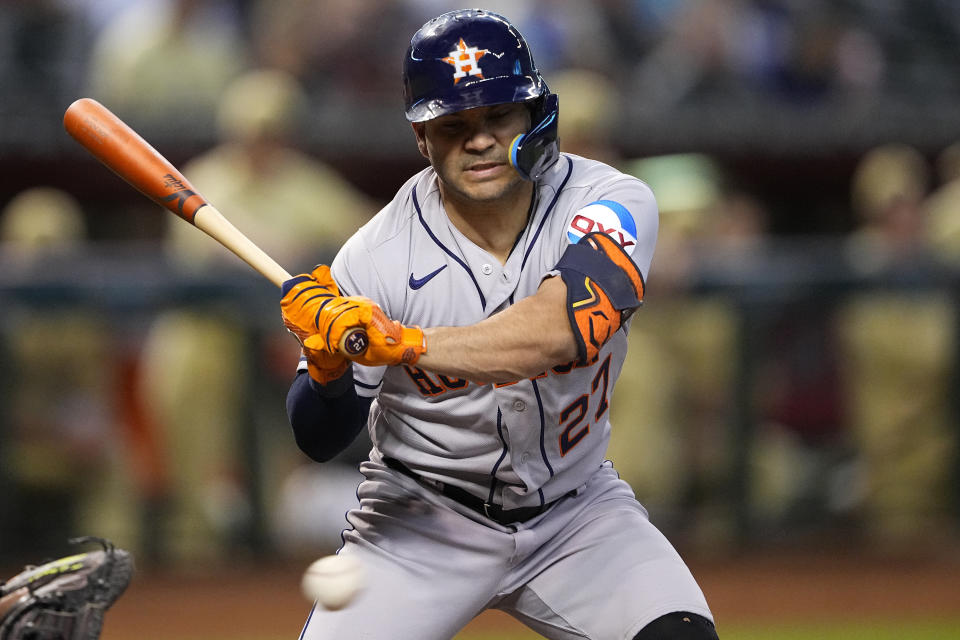 Houston Astros' Jose Altuve takes a ball during the first inning of a baseball game against the Arizona Diamondbacks, Friday, Sept. 29, 2023, in Phoenix. (AP Photo/Matt York)