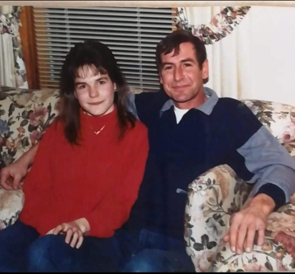 Sharon Halle sits next to Roland Halle for a picture.