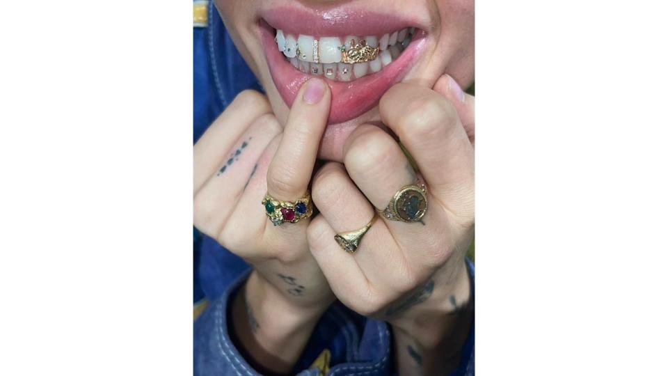 Insatgram mogul @linmick shows off her tooth gems 