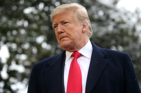 U.S. President Donald Trump speaks to the news media before boarding Marine One to depart for travel to New Orleans from the South Lawn of the White House in Washington, U.S., January 14, 2019. REUTERS/Leah Millis/Files