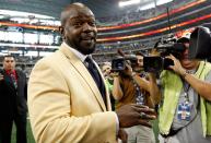 Former Dallas Cowboys running back Emmitt Smith reacts after receiving his Hall of Fame ring during a halftime ceremony at Cowboys Stadium on November 21, 2010 in Arlington, Texas. (Photo by Tom Pennington/Getty Images)