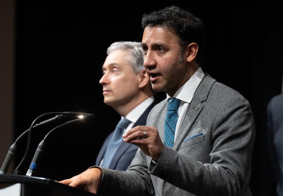 Innovation, Science and Industry Minister Francois-Philippe Champagne, left, looks on as Justice Minister and Attorney General of Canada Arif Virani responds to a question during a news conference at the National Summit on Combatting Auto Theft, in Ottawa, Thursday, Feb. 8, 2024.