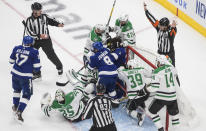 The referee stops play as the Dallas Stars and the Tampa Bay Lightning battle in the crease during second-period NHL Stanley Cup finals hockey action in Edmonton, Alberta, Saturday, Sept. 19, 2020. (Jason Franson/The Canadian Press via AP)