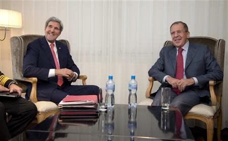 U.S. Secretary of State John Kerry (L) and Russia's Foreign Minister Sergei Lavrov smile during a photo opportunity prior to a meeting, in Geneva November 23, 2013. REUTERS/Carolyn Kaster/Pool