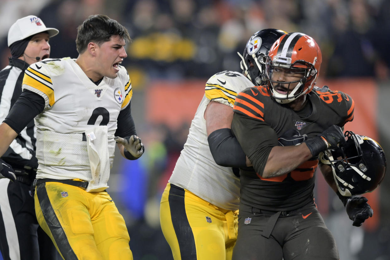 Cleveland Browns defensive end Myles Garrett (95) reacts after swinging a helmet at Pittsburgh Steelers quarterback Mason Rudolph. (AP Photo/David Richard)