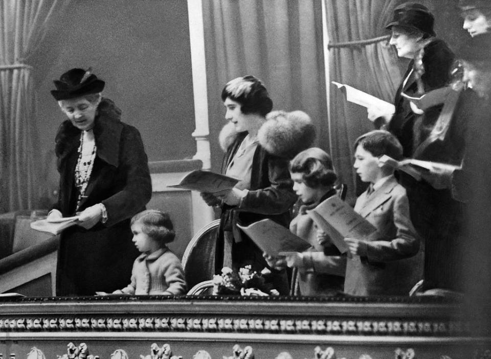 <p>Princess Elizabeth (second child from the right) sings Christmas carols with her family at a public concert in London's Albert Hall. The smaller girl in the photo is her younger sister, Princess Margaret.</p>