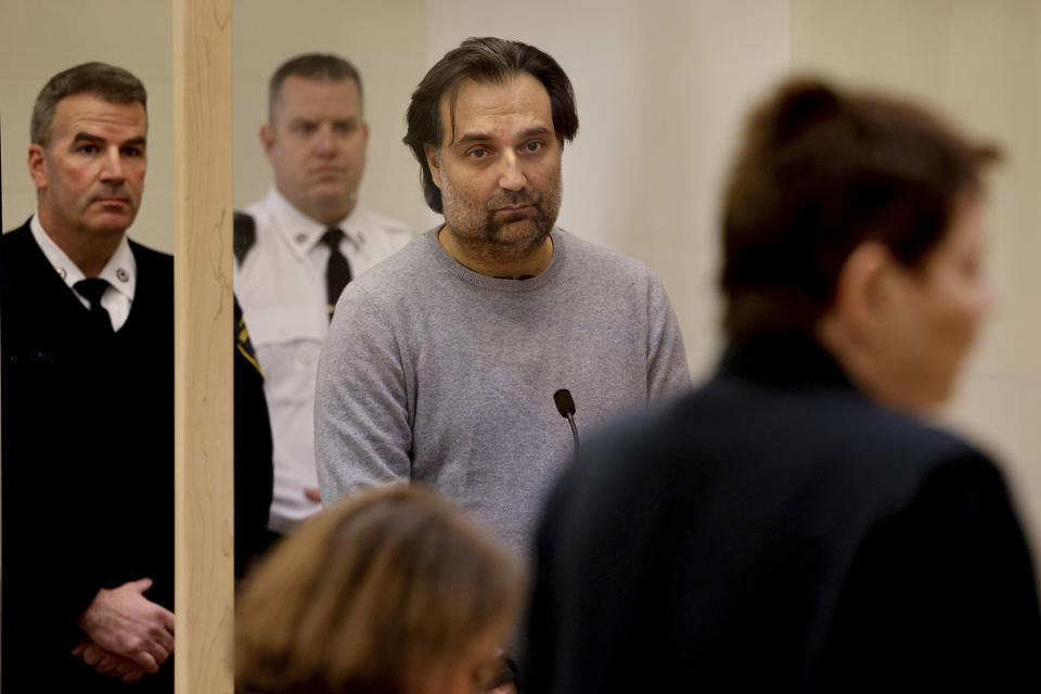 Brian Walshe, center, listens during his arraignment Wednesday, Jan. 18, 2023, at Quincy District Court, in Quincy, Mass., on a charge of murdering his wife Ana Walshe. Not guilty pleas were entered on behalf of Walshe, 47. Ana Walshe was reported missing Jan. 4, 2023 by her employer in Washington, where the couple has a home. (Craig F. Walker/The Boston Globe via AP, Pool)