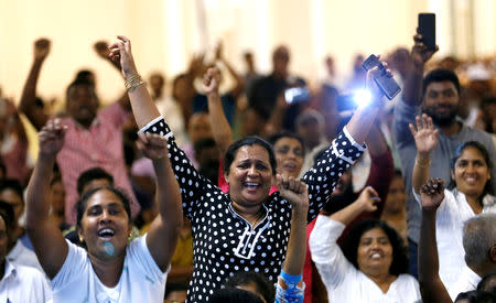 Supporters of Sri Lanka's ousted Prime Minister Ranil Wickremesinghe shout inside the Prime Minister office in Colombo, Sri Lanka October 27, 2018. REUTERS/Dinuka Liyanawatte