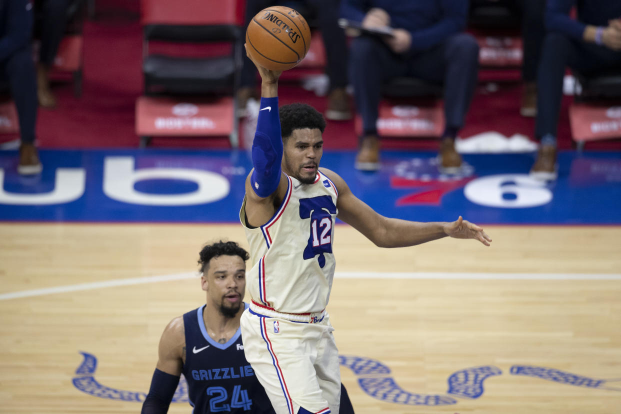 Tobias Harris #12 of the Philadelphia 76ers passes the ball against Dillon Brooks #24 of the Memphis Grizzlies at the Wells Fargo Center on April 4, 2021 in Philadelphia, Pennsylvania. NOTE TO USER: User expressly acknowledges and agrees that, by downloading and or using this photograph, User is consenting to the terms and conditions of the Getty Images License Agreement. (Photo by Mitchell Leff/Getty Images)