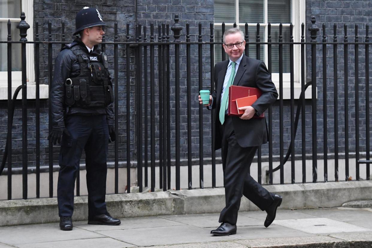 Environment Secretary Michael Gove holds a reusable coffee cup as he arrives in Downing Street: PA Wire/PA Images