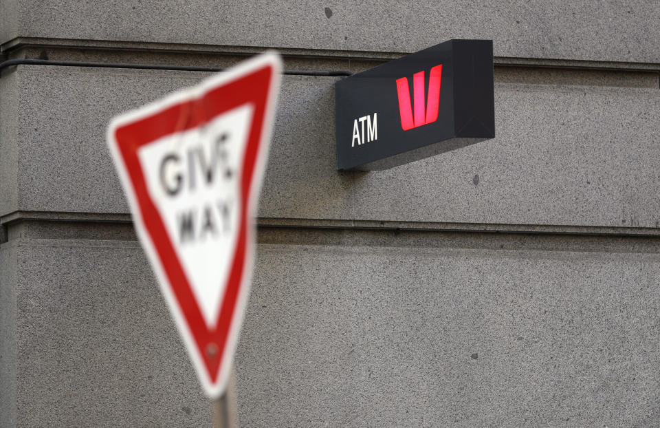 A Westpac bank ATM sign is posted on a wall in Sydney, Thursday, Sept. 24, 2020. Westpac, Australia's second-largest bank, agreed to pay a 1.3 billion Australian dollar ($919 million) fine for breaches of anti-money laundering and counterterrorism financing laws, the largest ever civil penalty in Australia, a financial crime regulator said. (AP Photo/Rick Rycroft)