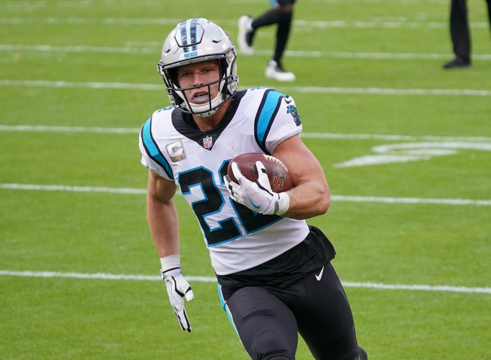 Nov 8, 2020; Kansas City, Missouri, USA; Carolina Panthers running back Christian McCaffrey (22) scores a touchdown against the Carolina Panthers during the first half at Arrowhead Stadium. Mandatory Credit: Denny Medley-USA TODAY Sports