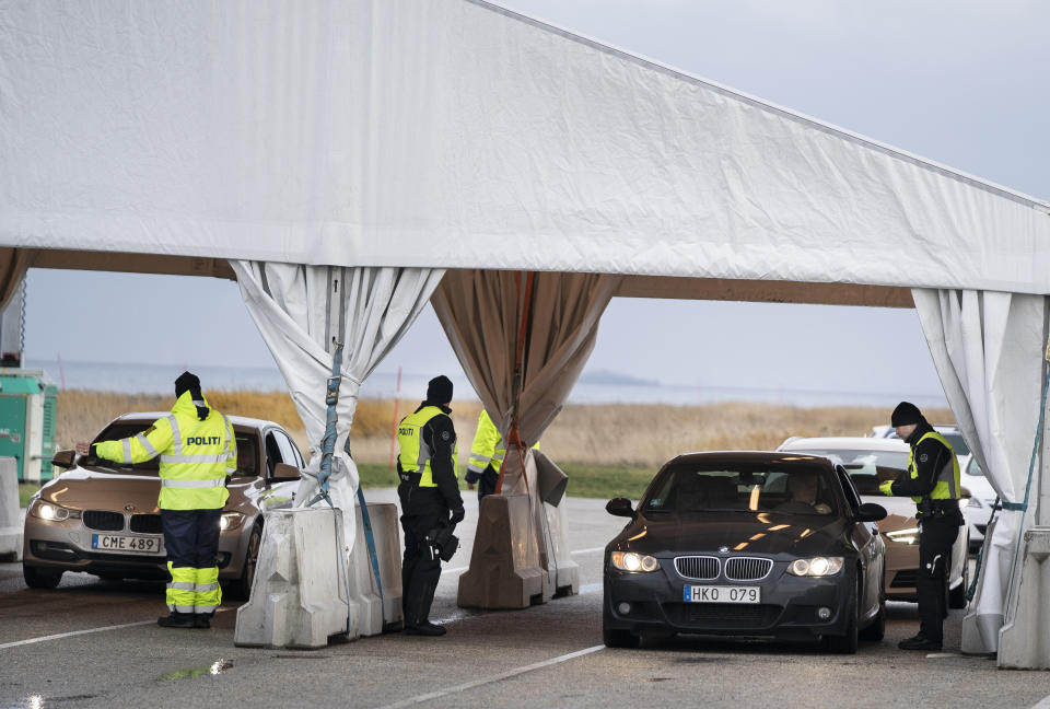 Danish police check travellers from Sweden, near the Highway coming out of the Tunnel near Copenhagen, Denmark, Tuesday Nov. 12, 2019. Danish police have begun to carry out border checks at its crossings with Sweden after a series of shooting crimes and explosions around Copenhagen that Danes say were carried out by perpetrators from the next-door neighbour. (Liselotte Sabroe/Ritzau Scanpix via AP)