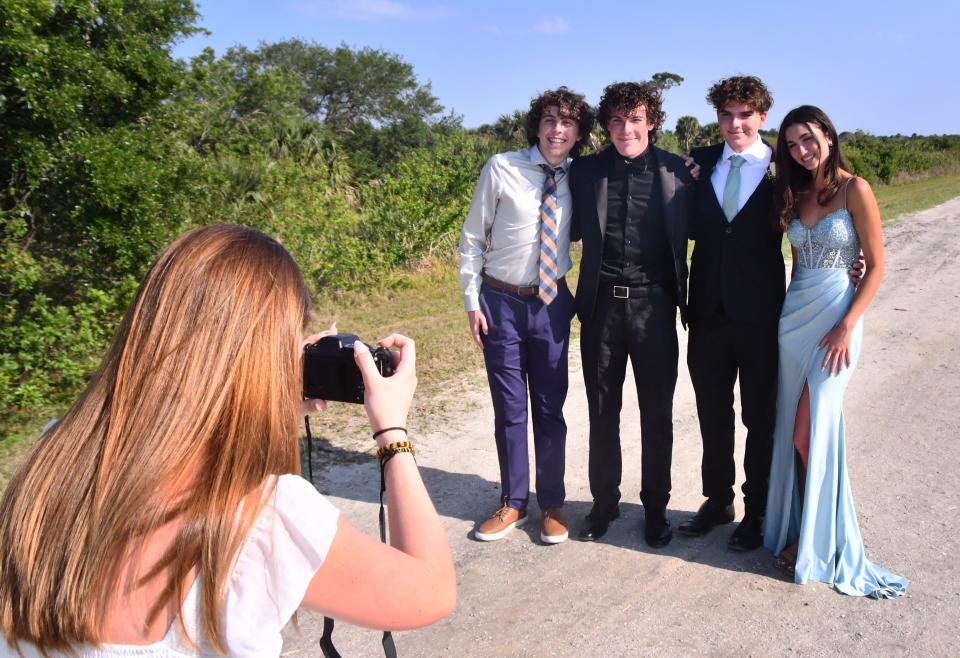 Jackson Reyier, Trey Pope, his brother Ty Pope and Ty's date, Ella Hovan, pose for photos taken by Trey and Ty's little sister, Cecelia Pope. The group headed out to Viera Wetlands for some pre-prom photos before going to the Edgewood Prom at the Rockledge Country Club.