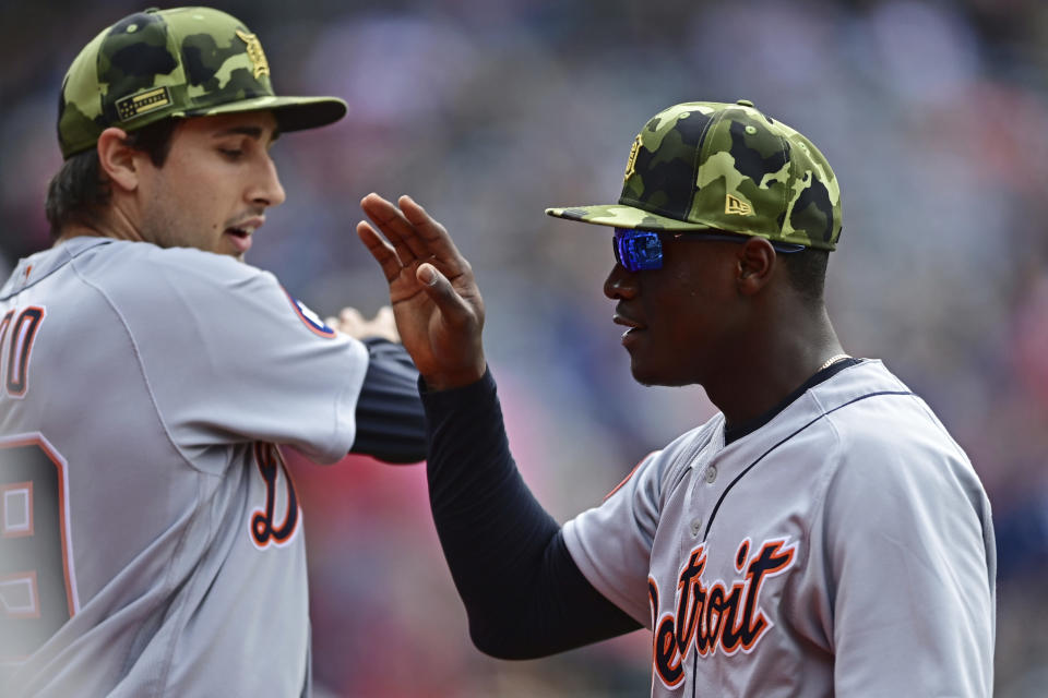 Detroit Tigers center fielder Daz Cameron, right, is congratulated by starting pitcher Alex Faedo after catching a ball hit by Cleveland Guardians' Amed Rosario in the fifth inning of a baseball game, Sunday, May 22, 2022, in Cleveland. (AP Photo/David Dermer)