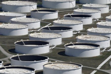 FILE PHOTO: Crude oil storage tanks are seen from above at the Cushing oil hub, appearing to run out of space to contain a historic supply glut that has hammered prices, in Cushing, Oklahoma, March 24, 2016. REUTERS/Nick Oxford/File Photo