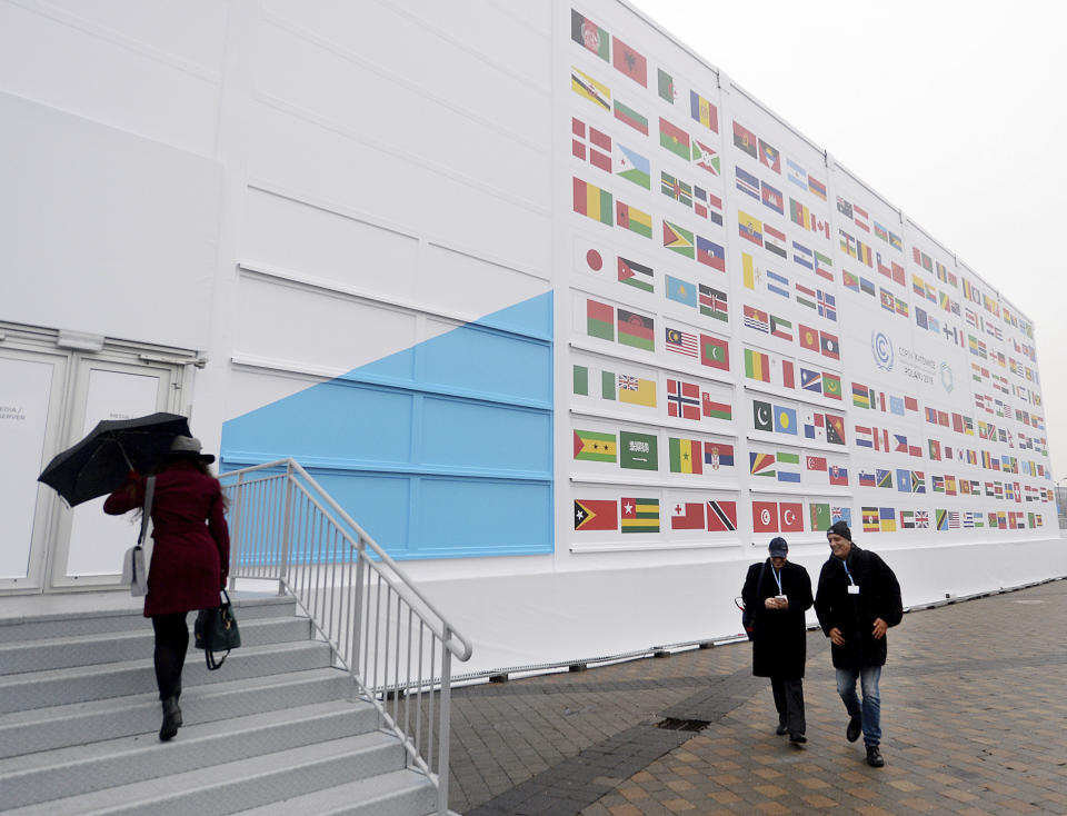 Guests arrive at the 'Spodek' multipurpose arena complex during to the COP24 summit in Katowice, Poland, Tuesday, Dec. 4, 2018. (AP Photo/Czarek Sokolowski)