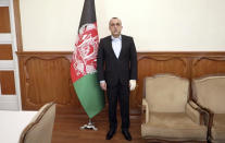 In this frame grab provided from a video by First Vice President Media office, First Vice President Amrullah Saleh stands in his office after an explosion in Kabul, Afghanistan, Wednesday, Sept. 9, 2020. Spokesman for Afghanistan's Interior Ministry said the bombing that targeted the convoy of Saleh on Wednesday morning killed several people and wounded more than a dozen others. (Vice President Media office via AP)