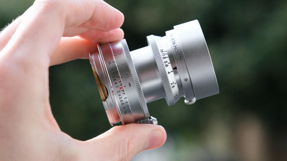 Thypoch Eureka lens held between two fingers