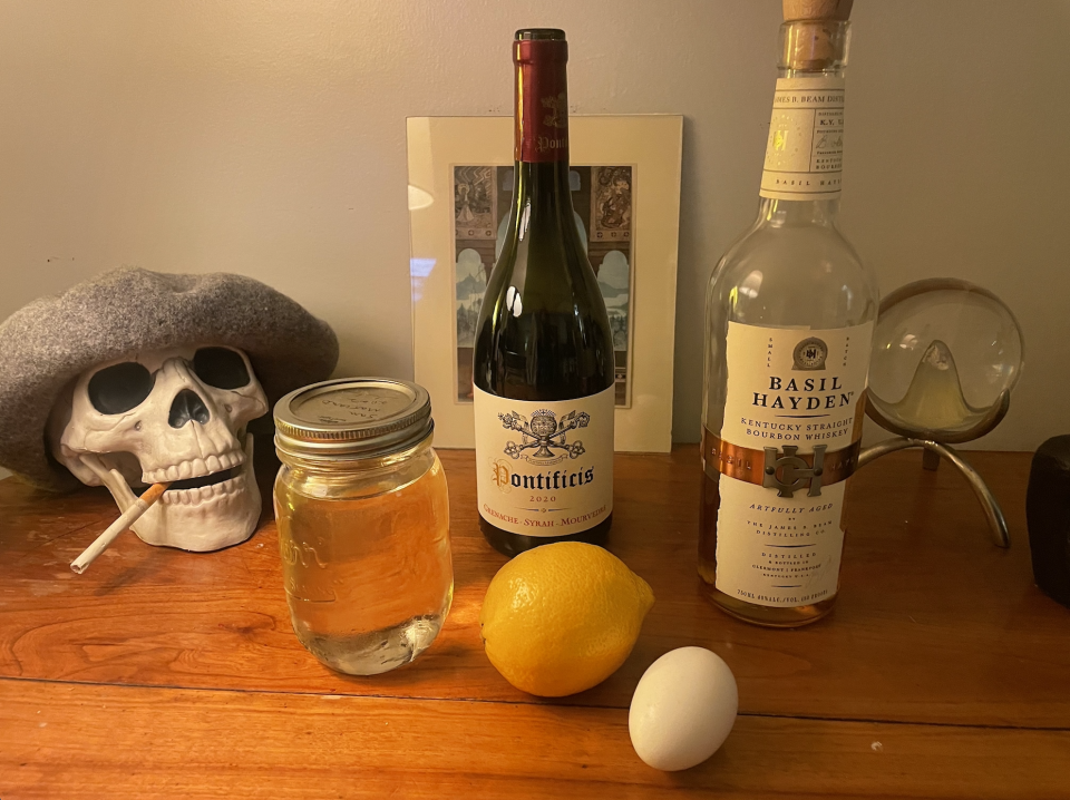 - 2 ounces of the whiskey of your choice (but use bourbon)- 3/4 ounces simple syrup - 1 ounce lemon juice - 1/2 ounce red wine - 1 egg white (optional) (it's what makes it foamy)- 1 maraschino cherry (optional) for garnish 