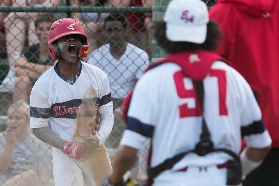 Eastmoor Academy’s Savion Watts celebrates scoring a run after getting caught up in a rundown during the City League baseball championship against visiting Centennial on Tuesday. Centennial won 12-3.