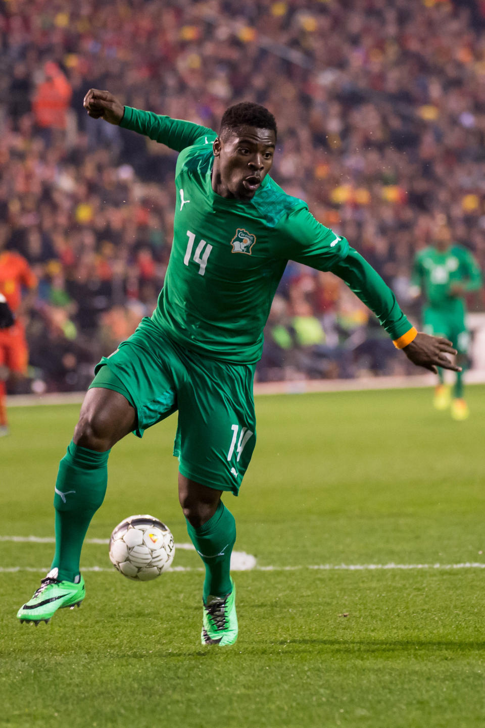 FILE - In this March 5, 2014, file photo, Ivory Coast's Serge Aurier runs with the ball during a friendly soccer match against Belgium at the King Baudouin stadium in Brussels. The Elephants had a comfortable qualification run under French coach Sabri Lamouchi, with a team filled with Europe-based talent including Manchester City's Yaya Toure. (AP Photo/Geert Vanden Wijngaert,File)