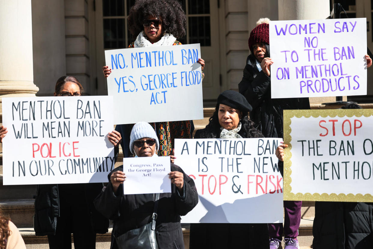 People hold signs against a menthol ban during a rally (Michael M. Santiago / Getty Images file)