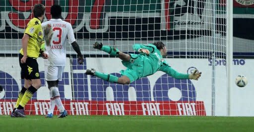 Augsburg's goalkeeper Simon Jentzsch (R) saves the ball during their German first division Bundesliga match vs Borussia Dortmund, in Augsburg, southern Germany, on March 10. Augsburg play Bayern Munich next, at Allianz Arena, on Saturday