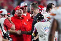 Kansas City Chiefs head coach Andy Reid, left, greets Arizona Cardinals head coach Kliff Kingsbury after an NFL football game, Friday, Aug. 20, 2021, in Glendale, Ariz. The Chiefs won 17-10. (AP Photo/Ross D. Franklin)