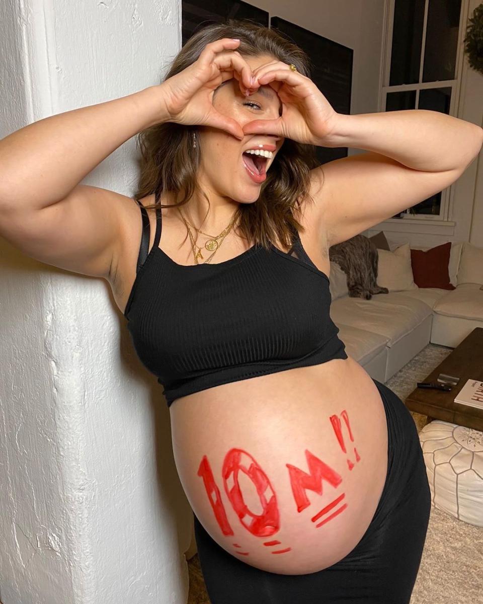 Ashley Graham poses with her bump