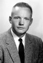 Portrait of Astronaut Neil A. Armstrong, commander of the Apollo 11 Lunar Landing mission in his space suit, with his helmet.