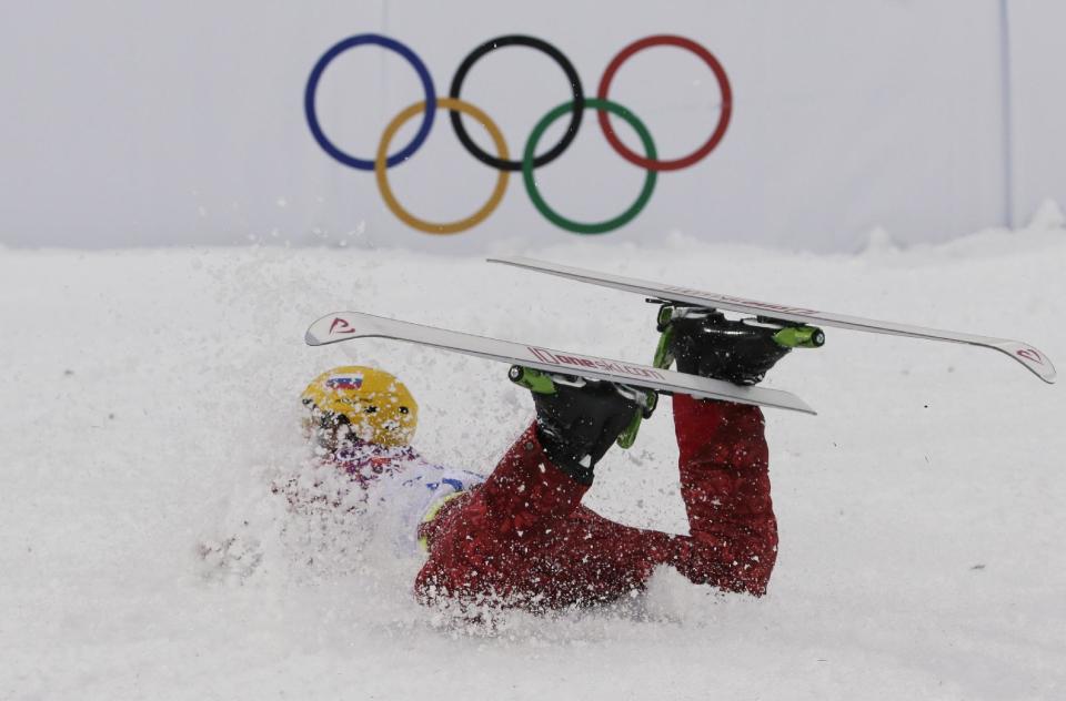 Russia's Ilya Burov crashes after landing during men's freestyle skiing aerials qualifying at the Rosa Khutor Extreme Park, at the 2014 Winter Olympics, Monday, Feb. 17, 2014, in Krasnaya Polyana, Russia. (AP Photo/Andy Wong)