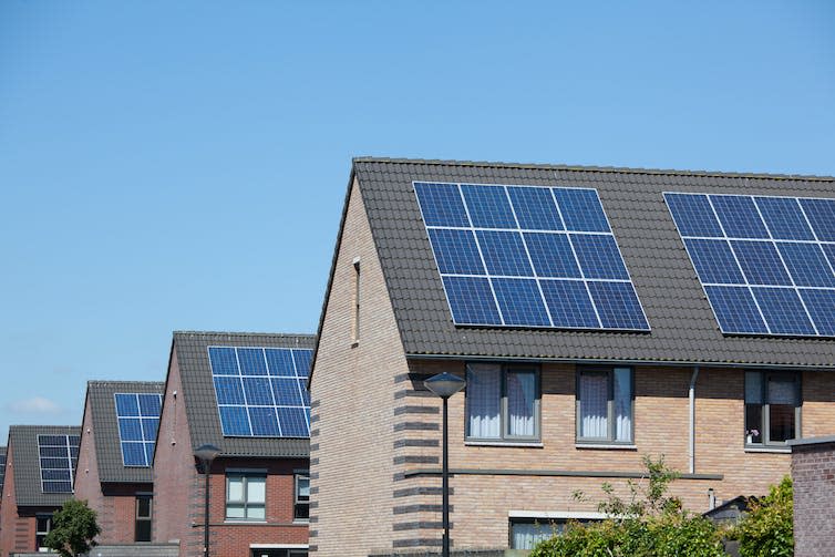 Houses with solar panels on roof