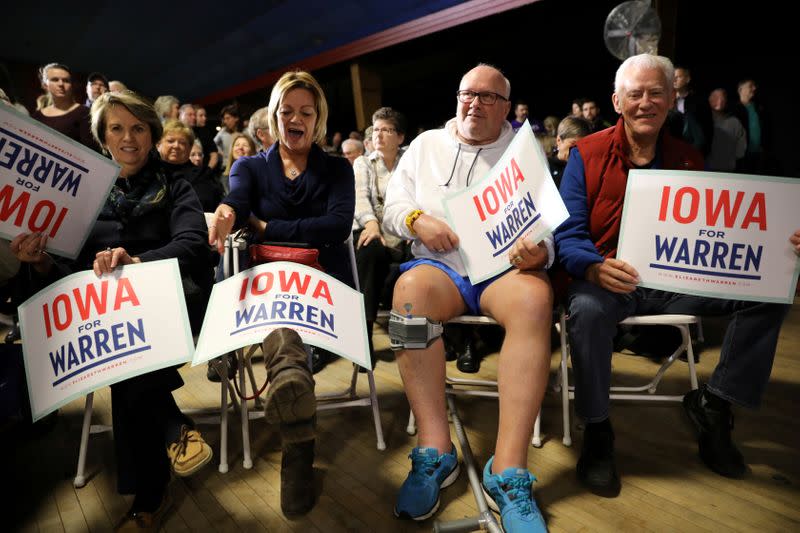 FILE PHOTO: Voters wait to hear U.S. Democratic presidential candidate Sen. Elizabeth Warren speak at a town hall event in West Des Moines