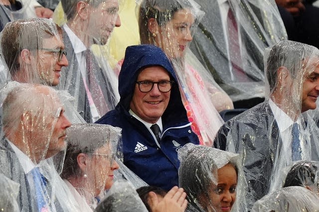 Prime Minister Sir Keir Starmer in his coat at the opening ceremony of the Olympic Games in Paris in the rain. 