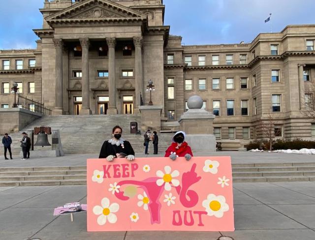 Julia Ballenger, 28, and Lisa Hunter, 37, pose outside the Idaho State Capitol Saturday after the sixth annual Idaho Women&#x002019;s March.