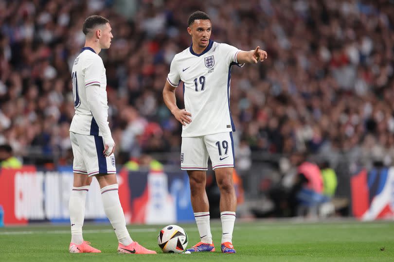 Trent Alexander-Arnold of England with Phil Foden of England during the international friendly match between England and Iceland at Wembley Stadium on June 07, 2024 in London, England.