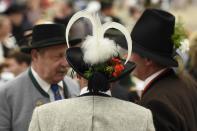 <p>Beer drinkers in traditional costumes chat in the “Tradition” tent. (Getty Images/Philipp Guelland) </p>