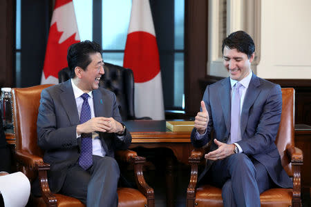 Canada's Prime Minister Justin Trudeau and Japan's Prime Minister Shinzo Abe react during a meeting on Parliament Hill in Ottawa, Ontario, Canada, April 28, 2019. REUTERS/Chris Wattie