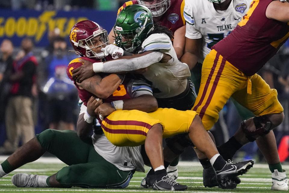 Southern California running back Austin Jones (6) is tackled during the second half of the Cotton Bowl NCAA college football game against Tulane, Monday, Jan. 2, 2023, in Arlington, Texas. (AP Photo/Sam Hodde)