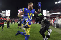 Los Angeles Rams wide receiver Cooper Kupp (10) celebrates as he leaves the field after the team defeated the Tampa Bay Buccaneers during an NFL divisional round playoff football game Sunday, Jan. 23, 2022, in Tampa, Fla. (AP Photo/Jason Behnken)