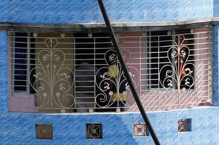 Security personnel are seen inside a house where police says militants were killed after a gunbattle on the outskirts of Dhaka, Bangladesh, August 27, 2016. REUTERS/Mohammad Ponir Hossain