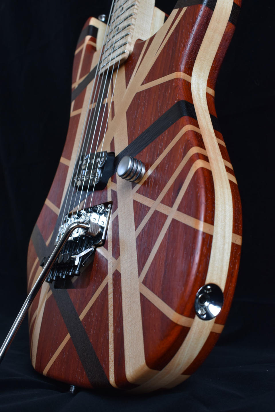 An Eddie Van Halen solid wood striped tribute guitar