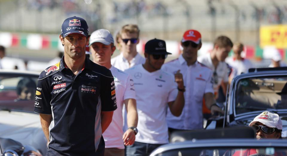 Red Bull Formula One driver Mark Webber of Australia attends the drivers' parade before the Japanese F1 Grand Prix at the Suzuka circuit October 13, 2013. REUTERS/Issei Kato (JAPAN - Tags: SPORT MOTORSPORT F1)