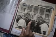 Rev. Charles Johnson, 82, points to an old photo of a gathering after the death of Rev. Martin Luther King Jr., during an interview with The Associated Press, in Meridian, Miss., Monday, Oct. 5, 2020. The old civil rights worker worries that Mississippi is drifting into its past. “I would never have thought we’d be where we’re at now, with Blacks still fighting for the vote,” said Johnson. (AP Photo/Wong Maye-E)