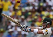 Australia's Brad Haddin plays a shot during the second day of the second Ashes cricket test against England at the Adelaide Oval December 6, 2013.