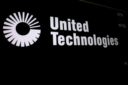 FILE PHOTO: United Technologies logo is displayed on a screen at the post where it's stock is traded on the floor of the NYSE in New York