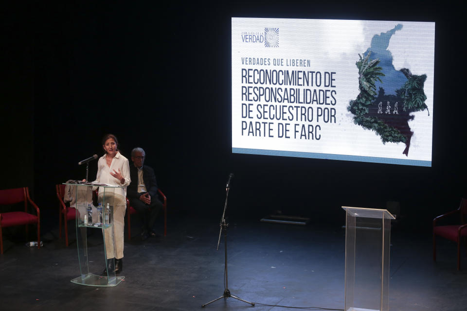 Former Colombian presidential candidate Ingrid Betancourt, who was abducted while campaigning by the Revolutionary Armed Forces of Colombia rebels, speaks during an event at the Truth Commission to commemorate victims of the country’s decades-long armed conflict, in Bogota, Colombia, Wednesday, June 23, 2021. (AP Photo/Ivan Valencia)